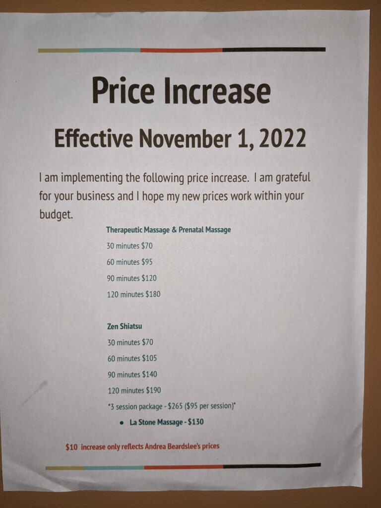 Sign says "Price Increase. Effective November 1, 2022" and then lists the rates for each service.